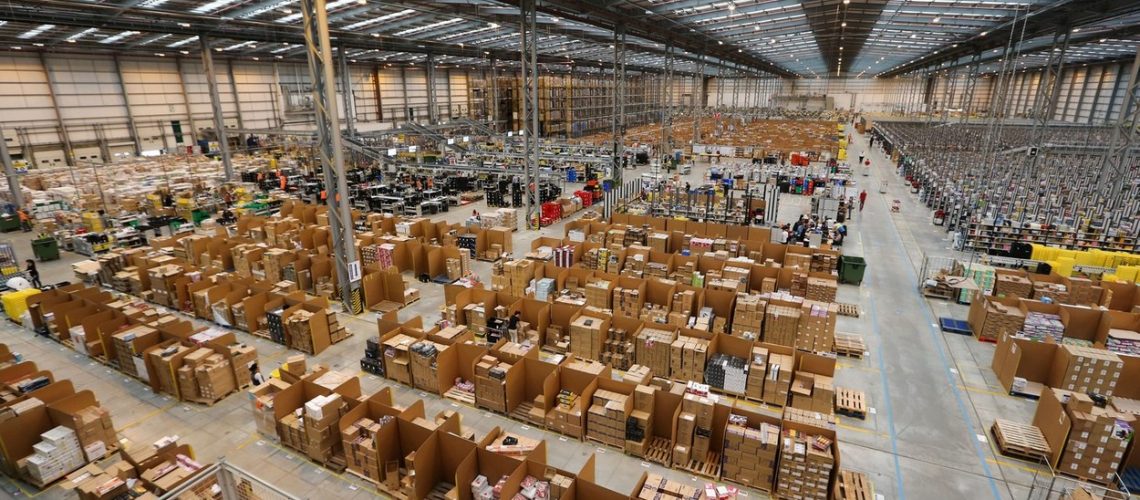 THE AMAZON WAREHOUSE IN PETERBOROUGH,CAMBS,ON THURSDAY NOV 7TH 2013.THE WAREHOUSE IS ABOUT TO HIT ITS  BUSIEST TIME  TO  THE BUILD UP TO CHRISTMAS AND COMPANY HAS EMPLOYED 50% EXTRA STAFF COMPARED TO LAST YEAR.Shopping website Amazon has increased its seasonal workforce by 50 PER CENT this Christmas to deal with the high demand from customers.The online retailer has hired more than 15,000 seasonal workers this year - a massive 5,000 more than in 2012.Staff at Amazon are already working flat out in its UK warehouses as orders pour in with less than 50 shopping days to Christmas.Workers at the Peterborough fulfilment centre in Cambridgeshire are picking and packing round the clock as millions begin their online Christmas shopping.Amazon predicts that the busiest day for online shopping in the UK, often referred to as Cyber Monday, will fall on December 2 this year, with post-work Christmas shoppers triggering a sales peak at 6pm.,Image: 176497203, License: Rights-managed, Restrictions: , Model Release: no