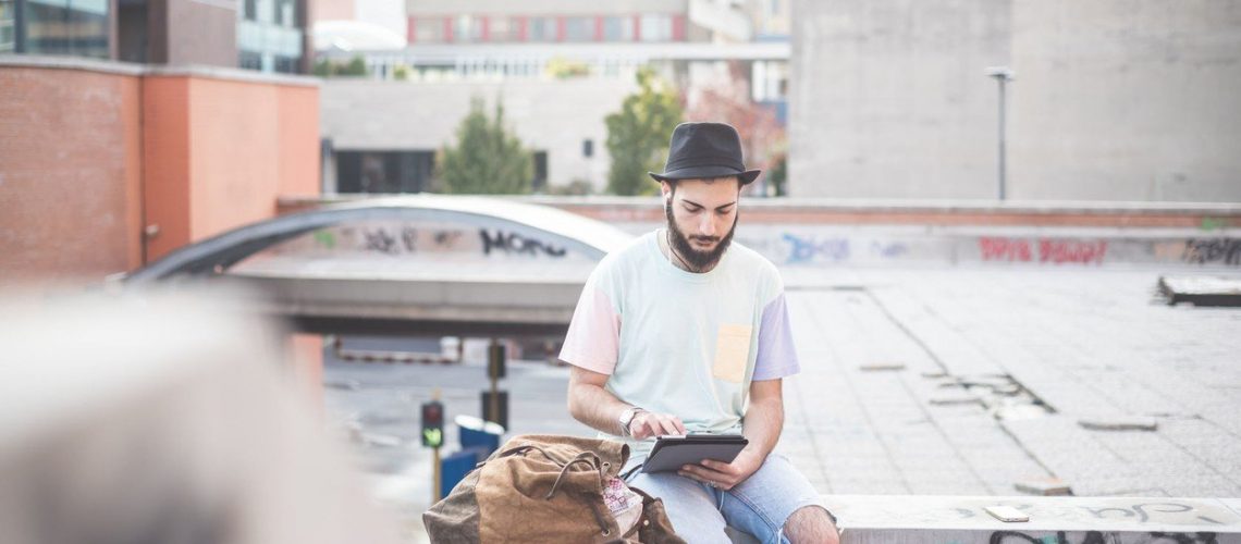 young handsome hipster gay modern man using tablet in town, Image: 217649884, License: Royalty-free, Restrictions: , Model Release: yes, Credit line: Profimedia, Stock Budget