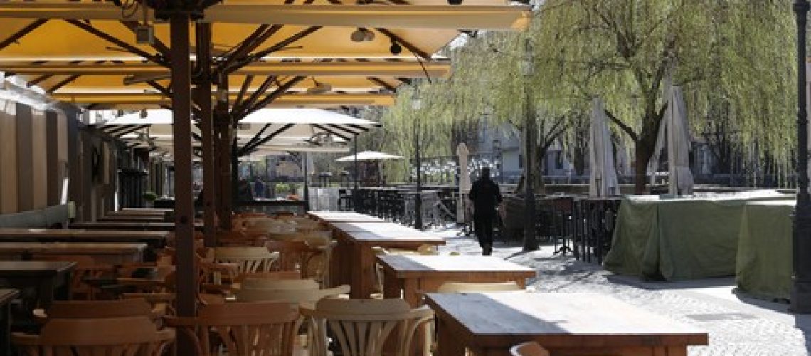(200317) -- LJUBLJANA, March 17, 2020 () -- A pedestrian walks past empty chairs of a restaurant in Ljubljana, capital of Slovenia, March 16, 2020.
  The number of confirmed COVID-19 cases in Slovenia rose to 253, according to the government on Monday. 
  The government decided to suspend public transport from Sunday midnight and indefinitely extend the previous decree on the closure of all educational institutions., Image: 507143896, License: Rights-managed, Restrictions: WORLD RIGHTS excluding China - Fee Payable Upon Reproduction - For queries contact Avalon.red - sales@avalon.red London: +44 (0) 20 7421 6000 Los Angeles: +1 (310) 822 0419 Berlin: +49 (0) 30 76 212 251, Model Release: no, Credit line: Peng Lijun / Avalon Editorial / Profimedia