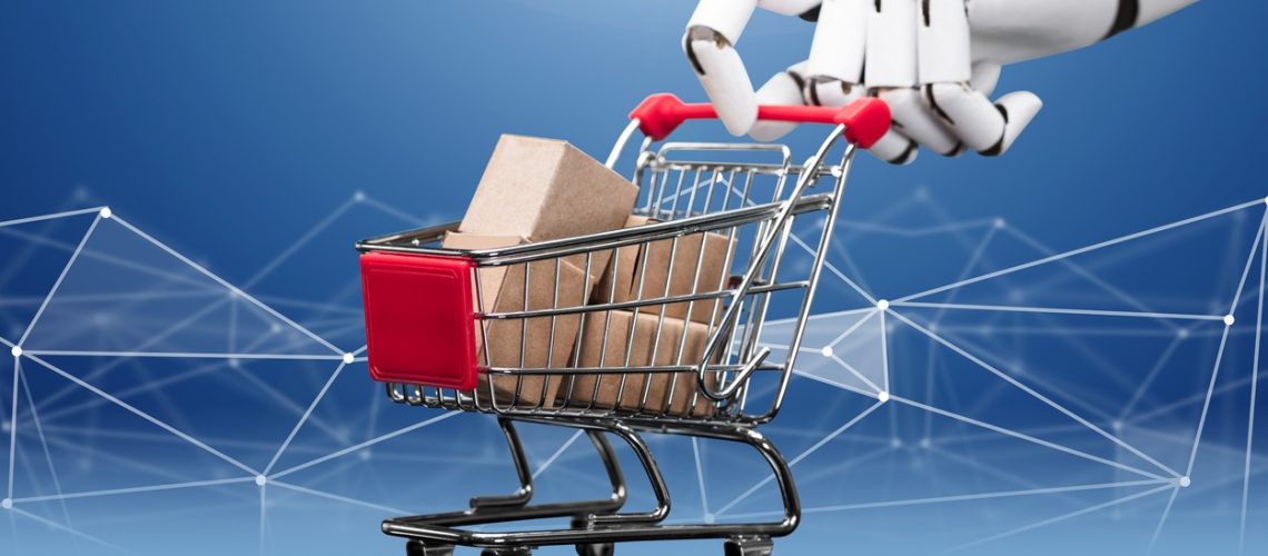 Robotic Hand Holding Miniature Shopping Cart Filled With Many Cargo Boxes Against Blue Technology Background,Image: 529079936, License: Royalty-free, Restrictions: , Model Release: no